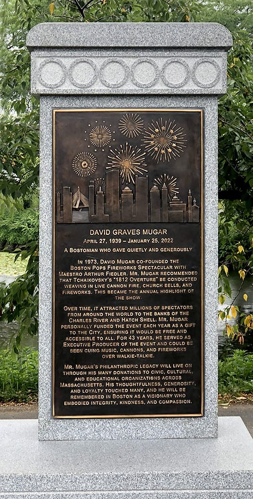 David Mugar Plaque IMG_7560 closeup of bronze plaque on granite pedestal surrounding by landscaping