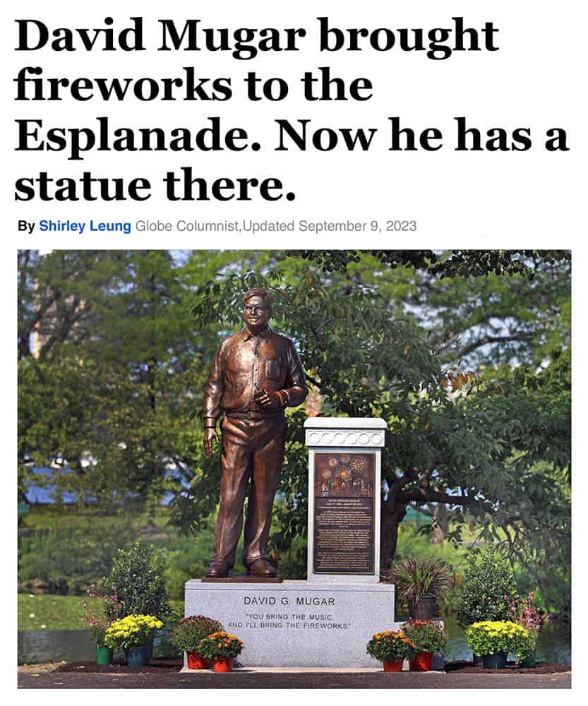 David Mugar Statue Dedication Sept 9 2023 Boston Globe-1 small file image of news article title and photo featuring statue of man standing on granite base surrounded by landscaping with river behind