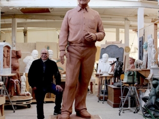 clay model of statue of man in sculpture studio with sculptor Robert Shure