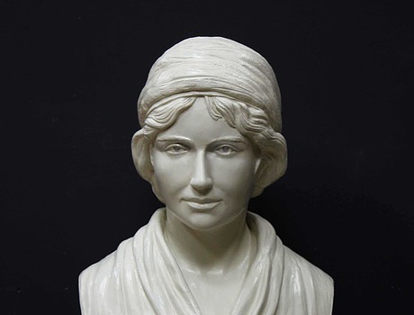 white plaster bust of female, namely Mary Wollstonecraft, against gray background